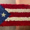 Floral arrangement shaped like the Puerto Rican flag