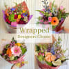 Collage of colorful wrapped mixed flower bouquets with "Wrapped Designers Choice" text.