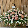 Large pink and white floral spray on a stand