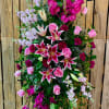 Tall standing floral spray with pink lilies and roses