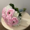 Bouquet of pink and white flowers with green leaves