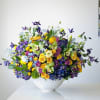Colorful mixed bouquet in a white vase