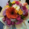 Bright mixed bouquet with roses, gerbera daisies, tulips, and chrysanthemums