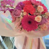 Pink and purple bouquet with gerbera daisies, roses, and orchids