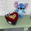 Heart-shaped box of red roses with chocolates and a plush Stitch toy
