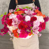 Large mixed bouquet with roses, orchids, and pink hydrangeas