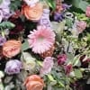 Mixed bouquet with pink, peach, and lavender flowers