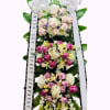 Tall sympathy standing spray with pink and white roses and ribbons