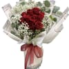 Bouquet of red roses with white baby's breath and eucalyptus in wrapping