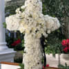 White floral cross arrangement with roses and chrysanthemums