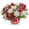 Red and white roses in a red ornamented vase