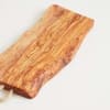 Wooden serving board with a clear handle on a white background