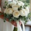 White rose bouquet with eucalyptus and ribbon