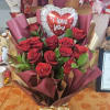 Bouquet of red roses with a heart-shaped "I love you" balloon