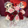 Bouquet of red and pink roses with two plush dolls and heart decorations