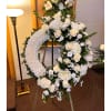 A unique design of roses, lisianthus, hydrangeas, greens and statice. 