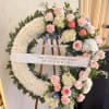 pink roses, carnations, delphinium, hydrangeas, various greens. 