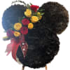 Mouse-ear shaped black floral wreath with red and yellow roses and a red MOM ribbon.