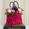 Indulge in the sheer elegance of our "Rose and Ranunculus Purse" arrangement