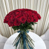Bouquet of red roses tied with a teal ribbon