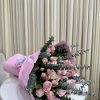 This enchanting bouquet combines the elegance of pink roses with the delicate