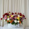 Ring in the new season with this delightful basket overflowing with colorful