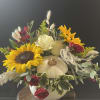 Ceramic white pumpkin filled with fresh fall blooms to welcome in the