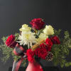 a beautiful holiday arrangement filled with festive flowers.