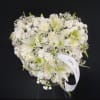 Heart-shaped white floral spray with a white ribbon