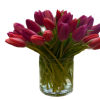 Bouquet of pink and purple tulips in a clear glass vase
