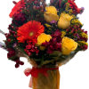 Bouquet of yellow roses and red gerbera daisies in a wrapped vase