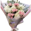 Pink roses and white hydrangeas wrapped in iridescent paper