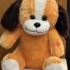 Orange and white plush dog toy with dark floppy ears