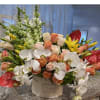 Mixed bouquet of white orchids, peach roses, yellow lilies, and red anthuriums in a white box