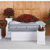 Red rose funeral casket spray with matching standing arrangements