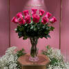 Hot Pink Roses arranged in a wonderful clear vase good for a