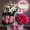 A stunning floral arrangement featuring an extra-large bouquet of white Stargazer lilies