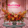 A captivating  flawlessly arranged autumn floral display
adorned with an exquisite assortment