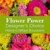 Colorful mixed flowers with a green text banner reading Flower Power