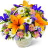 Basket arrangement with orange lilies, daisies, and purple flowers