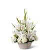 White floral arrangement in a woven basket