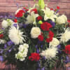 Large red, white, and purple floral spray with lilies and carnations