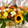 Beautiful fall florals and greens make a gorgeous table centerpiece for your