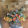 A refined expression of natural beauty, this bespoke floral arrangement captures the