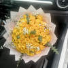 Bouquet of yellow roses with baby's breath and eucalyptus in pink wrap