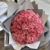 Large bouquet of pink roses wrapped in gray paper