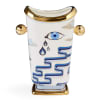 Decorative white ceramic vase with gold accents and blue eye motifs