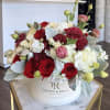 Gorgeous box filled with fine flowers in burgundy colors. An excellent present