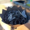 Bouquet of black roses with decorative butterfly accents