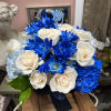 Blue and white bouquet of roses, hydrangeas, and daisies with a ribbon